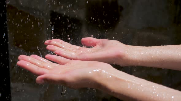 Drops of Water Drop On Women's Hands