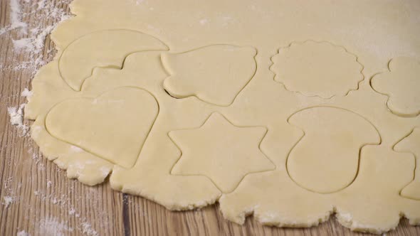 The process of making cookies from shortbread dough. alt