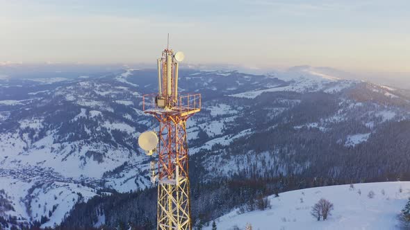 Flying Over Radio Communications Tower Mountain Snow Covered Winter Landscape alt