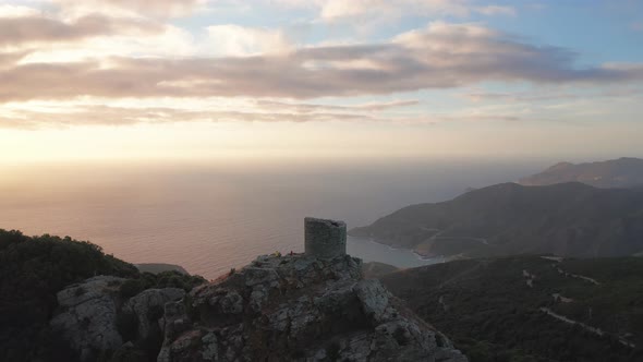 Aerial Orbital View of Old and Ancient Building Looking at the Sea Panorama During Sunsetgreen alt