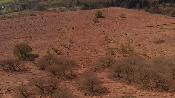 Drone travelling towards a Peak in the Peak District while panning up from Bamford Edge Alternative alt