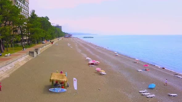 View from drone to beach along sea with green vegetation. Georgia. Kobuleti. alt