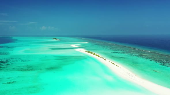 Aerial drone shot tourism of luxury seashore beach voyage by shallow ocean with white sandy backgrou alt