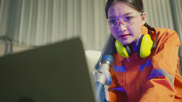 asian female engineer specialist with Measuring machine with a manipulator arm
