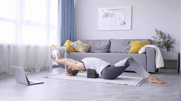 Yoga Trainer Practices Morning Exercises