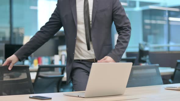 Businessman Coming Back to Work in Office alt