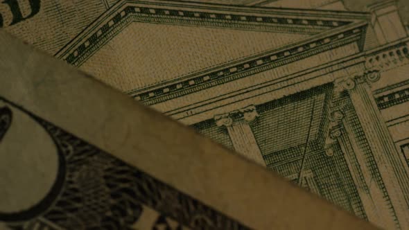 Rotating footage shot of American paper currency on an American eagle shield background - MONEY 0417 alt