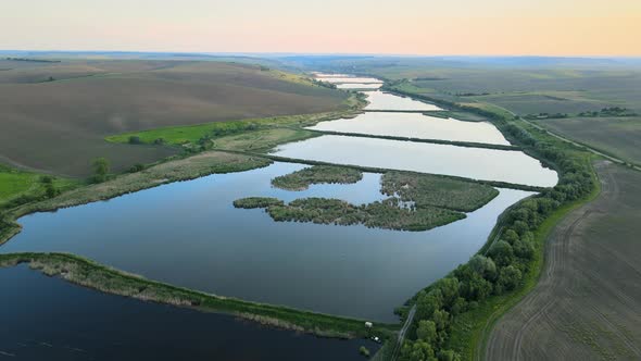 Aerial View of Fish Hetching Pond with Blue Water in Aquacultural Area alt