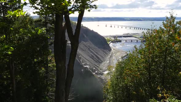 Overlooking The Base Of The Montmorency Falls In Quebec City With A Bridge In The Background