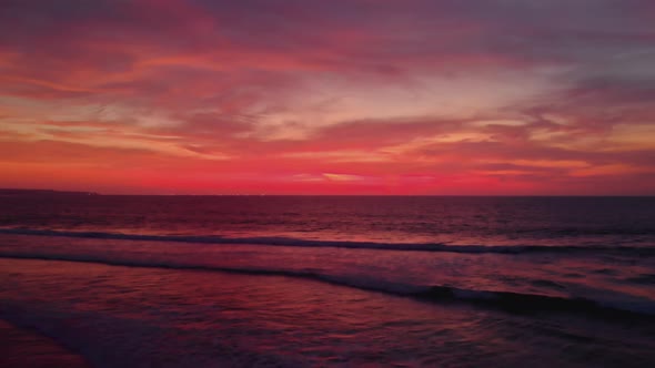 Flight at Sunset Overlooking the Indian Ocean in Bali Indonesia alt