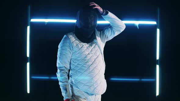 Male Fencer is Ready to Start a Fencing Practice alt