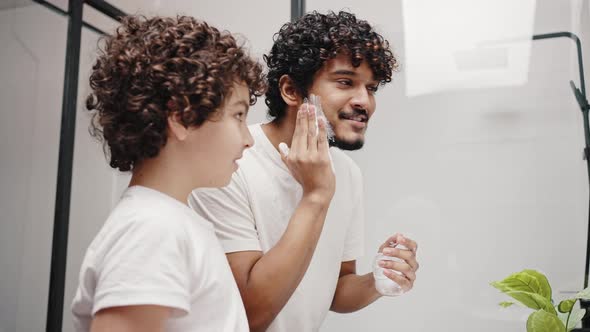 Indian Man Puts Shaving Foam on Younger Brother Face for Fun alt