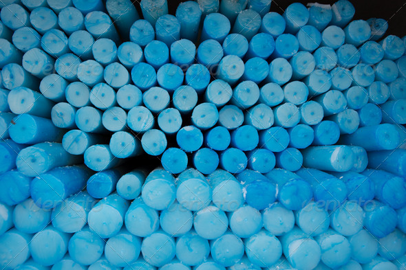 Close up of a group of blue circle candles in Lourdes in France. - Stock Photo - Images