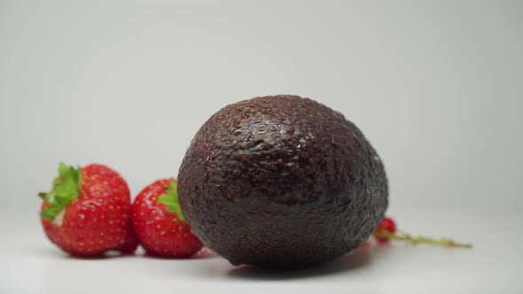Avocado, Strawberries And Red Currants - Set Of Delicious And Fresh Fruits For Dessert - Close Up Sh alt