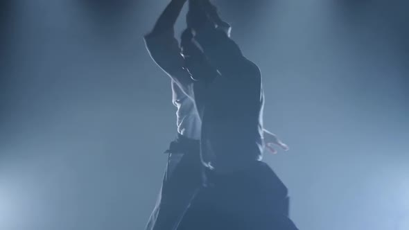 Fight Between Two Aikido Fighters in the Dojo. Slow Motion. Close Up. alt