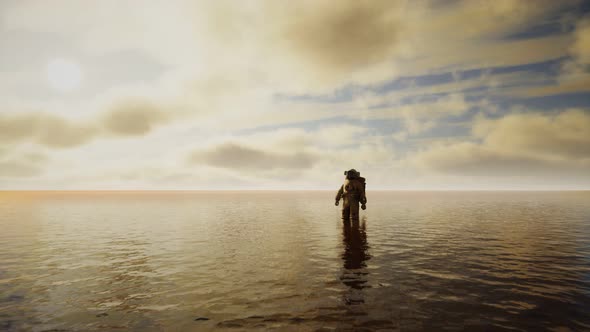 Spaceman in the Sea Under Clouds at Sunset alt