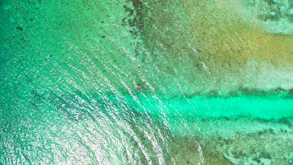 Daytime drone abstract view of a summer white paradise sand beach and aqua blue ocean background in  alt