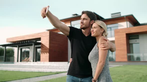 Cheerful Couple Taking Selfie Outdoor. Portrait of Happy Family Making Selfie alt