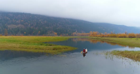Man Rowing a Boat on A Lake 4k alt
