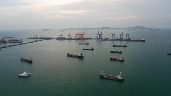 Drone flying with Refinery industry cargo ship. Fuel for transport.