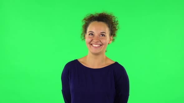 Portrait of Curly Woman Sbursting with Laughter Being in Positive. Green Screen alt