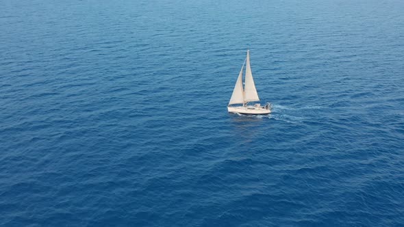 Aerial View Yacht Sailing on Opened Sea. Sailing Boat Yacht From Above. Yachting at Windy Day. alt
