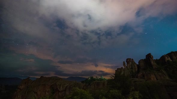 Milky Way galaxy, moving clouds, plane trails and meteor shower, during Perseid stream alt