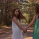 Two Beautiful Girls Walking in the Woods - VideoHive Item for Sale