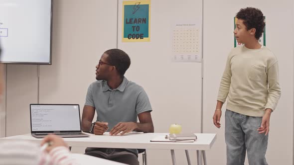 Biracial Boy Speaking at Lesson alt