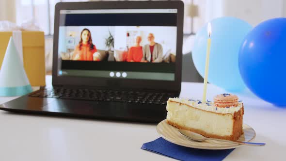 Laptop with Family Having Virtual Birthday Party alt