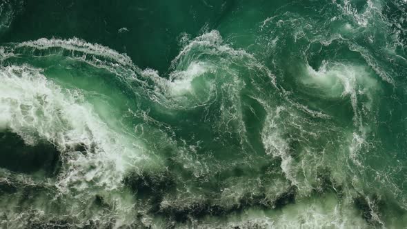 Waves of Water of the River and the Sea Meet Each Other During High Tide and Low Tide alt