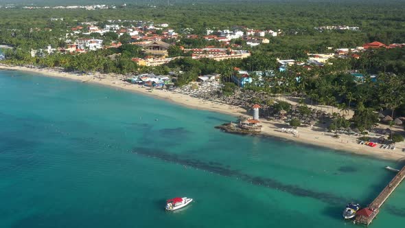 Dominicus Beach at Bayahibe with Caribbean Sea Sandy Seashore Lighthouse and Pier alt