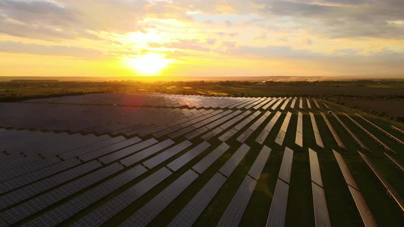 Aerial View of Big Sustainable Electric Power Plant with Rows of Solar Photovoltaic Panels for alt