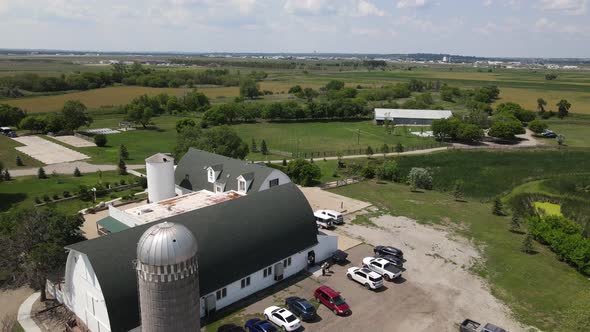 Aerial view of a white building with a gray roof in Bismarck on a sunny day