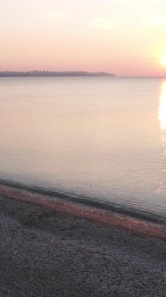 Vertical Video Dawn Over the Sea Aerial View alt