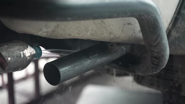 blacksmith welder works with metal steel and iron using a welding machine, bright sparks and flashes alt