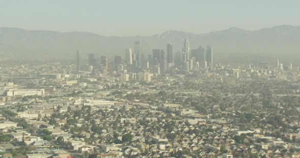 Aerial helicopter shot, twist up and around a snowy peak, drone footage alt