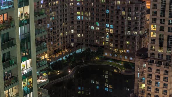 Manmade Lake and Residential Buildings in Greens Neighbourhood Night Timelapse in Dubai UAE alt