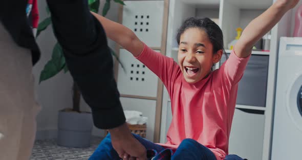 Father's Play with Child in Laundry Room Bathroom While Doing Household Chores alt