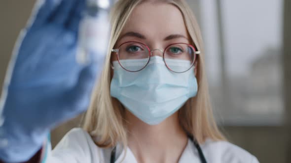 Closeup Female Specialist Chemist Biochemist Woman Doctor Nurse Scientist in Medical Mask Glasses alt
