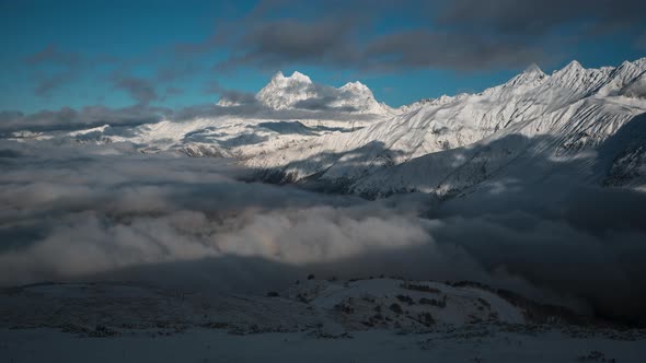 Panorama of Snowy Mountains and Clouds Timelapse