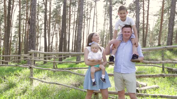 Portrait Family Playing on Picnic in a Park alt
