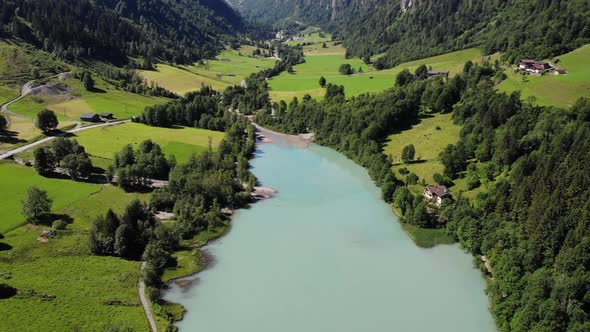 Countryside Landscape With Calm Lake Water And Lush Vegetation In Klammsee, Kaprun, Austria - aerial alt