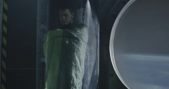 Astronauts Sleeping in Glass Capsules alt