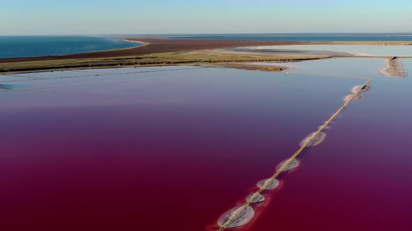 Beautiful top view of the salty, pink lake. Beautiful pink sunrise. alt