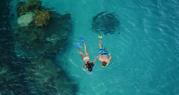 Aerial View of Young Couple Snorkeling alt