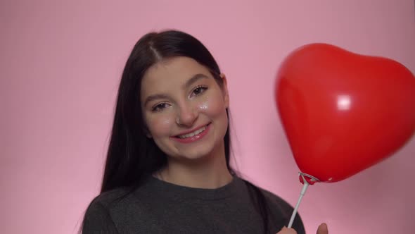 Happy Woman with Red Heart Balloon St