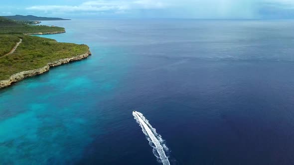 Aerial view of a jet ski in Westpunt, Curacao, Dutch Caribbean island. Horizon with vegetation and c alt