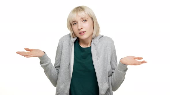 Portrait of Shorthaired Blondie 20s Woman Throwing Up Hands in Rejection Shrugging Pitifully Saying alt
