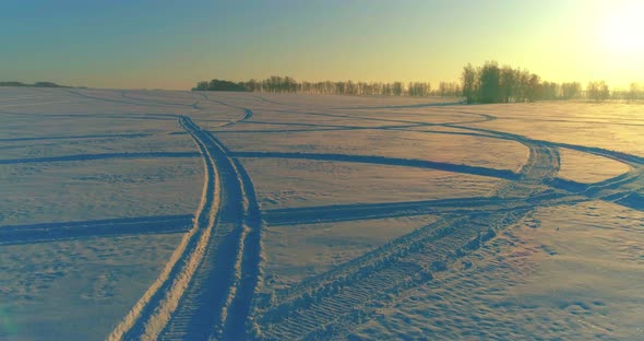 Aerial Drone View of Cold Winter Landscape with Arctic Field, Trees Covered with Frost Snow alt